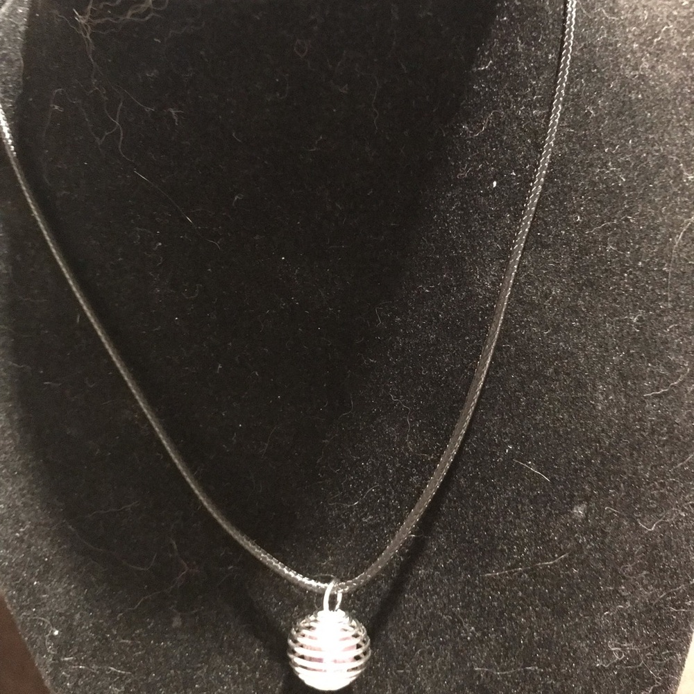 Elegant Silver Cage necklace with amethyst crystal